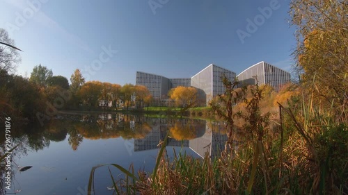 Autumn Colored Tree Foliage And Modern Buildings In Vilnius, Lithuania. 4K Stock Footage photo