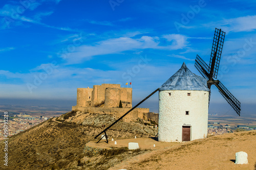 Large Shot Of One Windmill With The Castle In The Background In Consuegra. December 26, 2018. Consuegra Toledo Castilla La Mancha Spain Europe. Travel Tourism Street Photography.