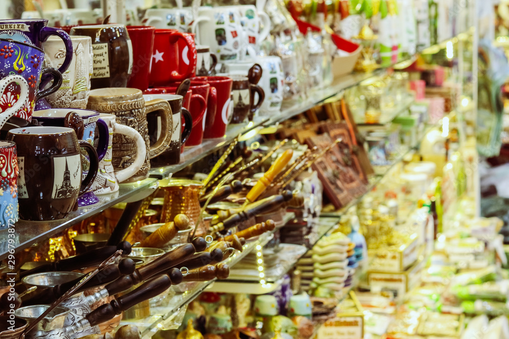 Souvenirs stand in a row on a shelf. Close-up. City souvenir bazaar. Kemer, Turkey. Souvenirs stand in a row on a shelf. Close-up. City souvenir bazaar. Kemer, Turkey.