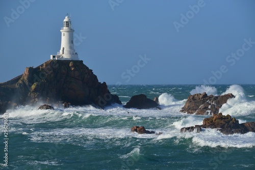 La Corbiere point, Jersey, U.K. Lighthouse with stormy conditions from the Atlantic.