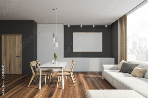 Gray dining room interior with sofa and poster