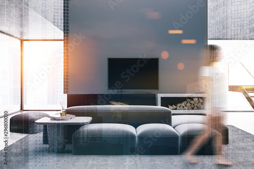 Woman walking in living room with TV