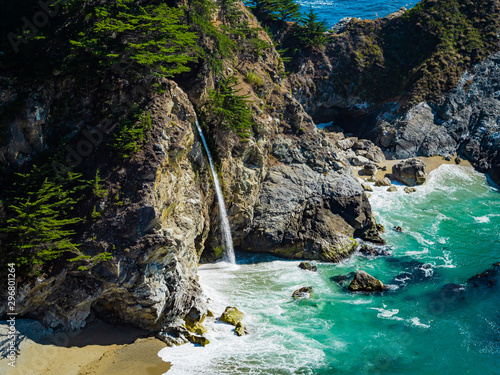Aerial view of Water Fall McWay Falls Julia Pfeiffer Burns Park Big Sur California. McWay Falls a waterfall empties directly into the ocean.