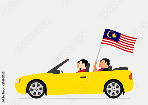 People in car with malaysia flag