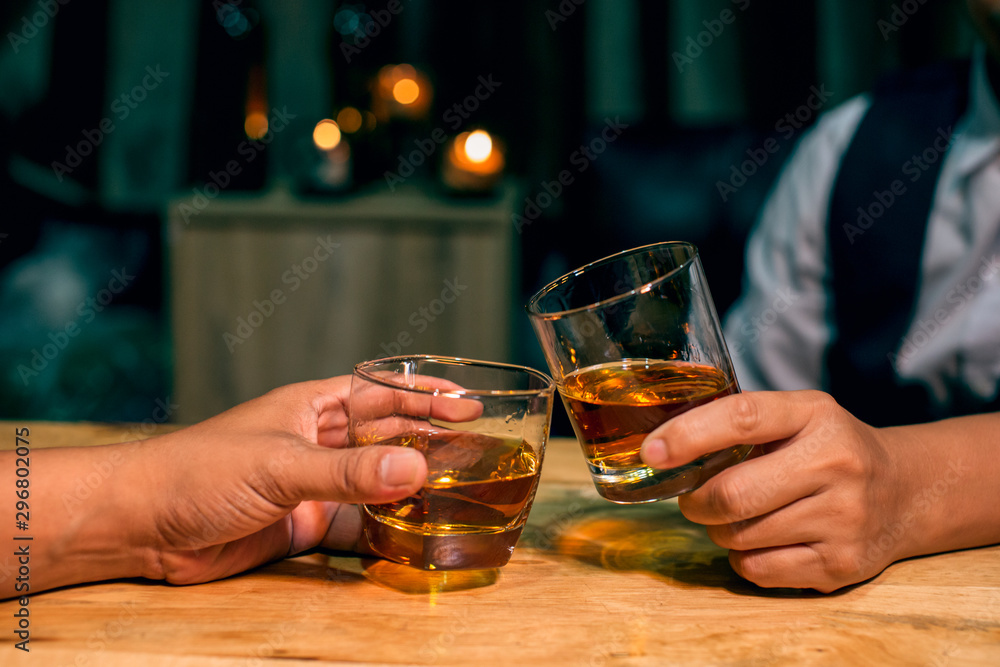man with glass of whiskey