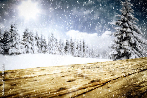 Snowy glittering winter landscape with space for products and decorations. Happy Christmas time. © magdal3na