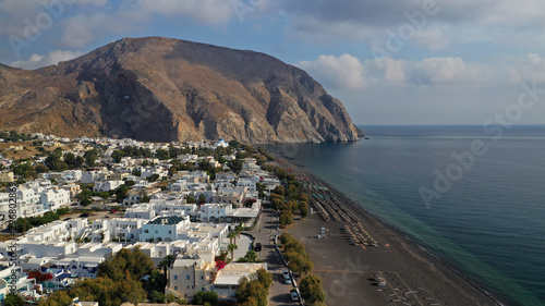Aerial drone photo of famous volcanic beach and bay of Perissa village, Santorini island, Cyclades, Greece © aerial-drone