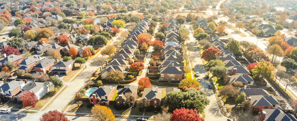 Aerial view row of new house with cul-de-sac (dead-end) and bright orange color fall foliage near Dallas