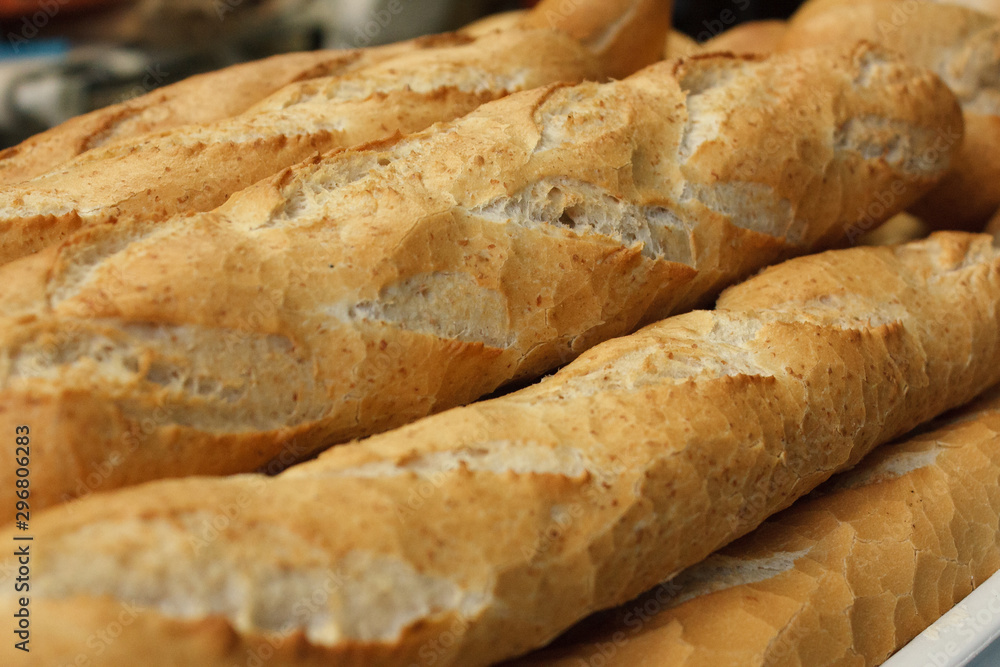 Wholemeal bread sticks fresh from the oven in a bakery