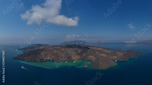 Aerial drone top down photo of iconic main Crater of Santorini volcanic island called Kameni visited by tourist boats  Cyclades  Greece