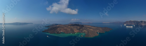 Aerial drone top down photo of iconic main Crater of Santorini volcanic island called Kameni visited by tourist boats, Cyclades, Greece