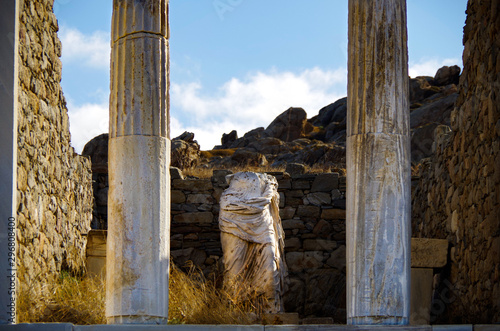  Ancient and historic temple ruins with columns and walls on museum island Delos excavation site in Greece in the Aegean Sea with Apollon Sanctuary photo