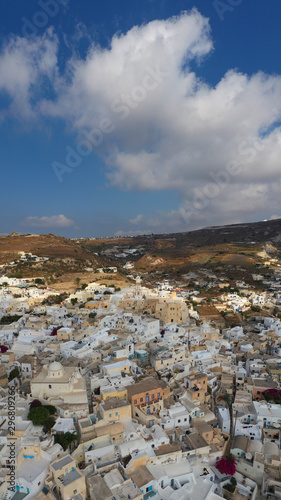 Aerial drone photo of iconic small traditional village and castle of Emporio in the heart of Santorini island, Cyclades, Greece © aerial-drone
