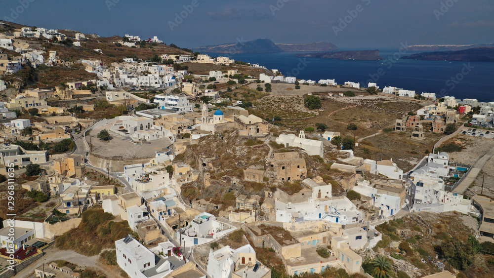 Aerial drone photo of iconic small traditional village of Akrotiri near famous archaeological site, Santorini island, Cyclades, Greece