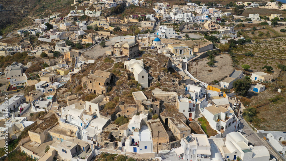 Fototapeta premium Aerial drone photo of iconic small traditional village of Akrotiri near famous archaeological site, Santorini island, Cyclades, Greece