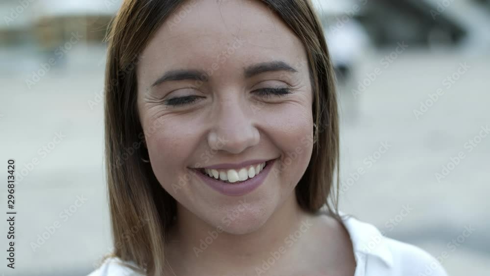 Closeup shot of cheerful young woman. Beautiful Caucasian woman looking at camera. Female beauty concept Closeup shot of cheerful young woman. Beautiful Caucasian woman looking at camera. Female beauty concept