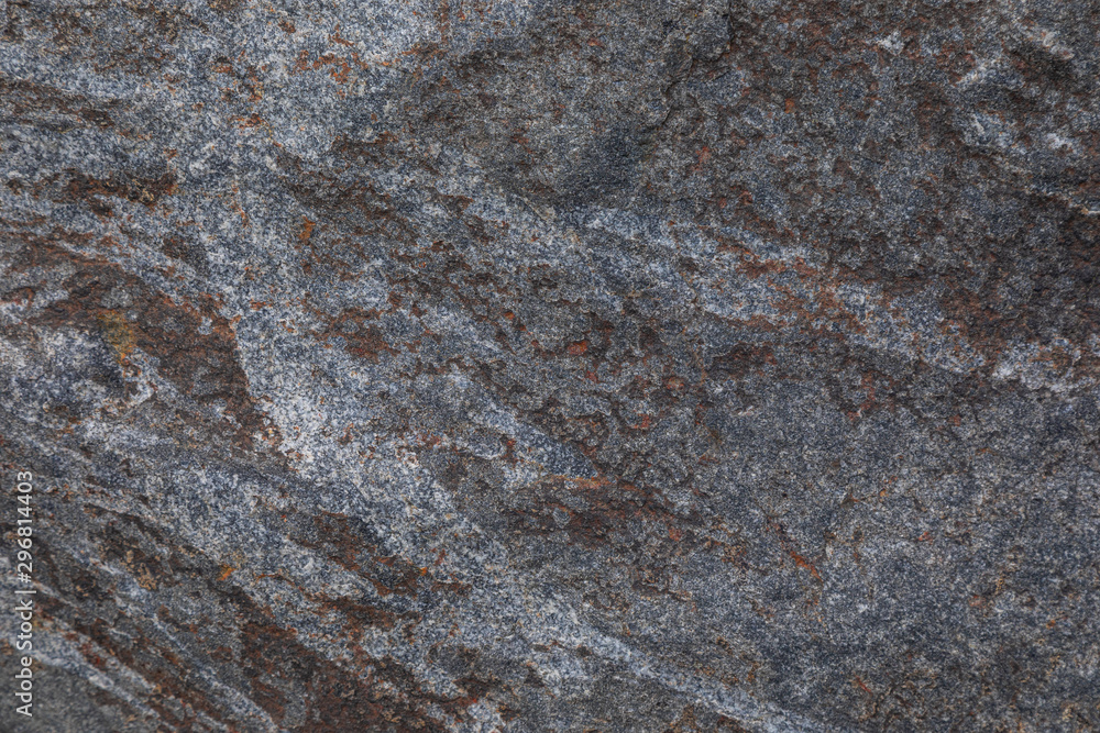 Elevated view of grey rugged granite stone surface Elevated view of grey rugged granite stone surface