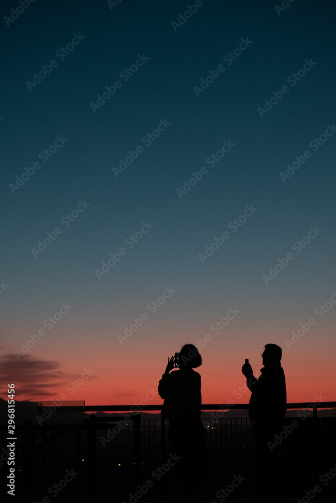 Silhouette of tourists watching the sunset