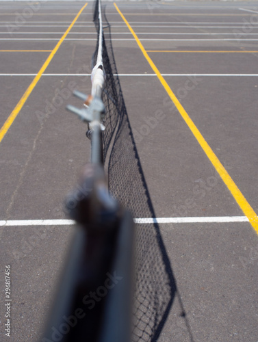Along The Top Of A Tennis Net On A Tennis Court