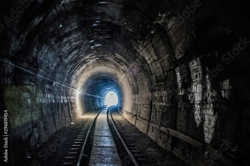 Fototapeta Old train tracks in a tunnel