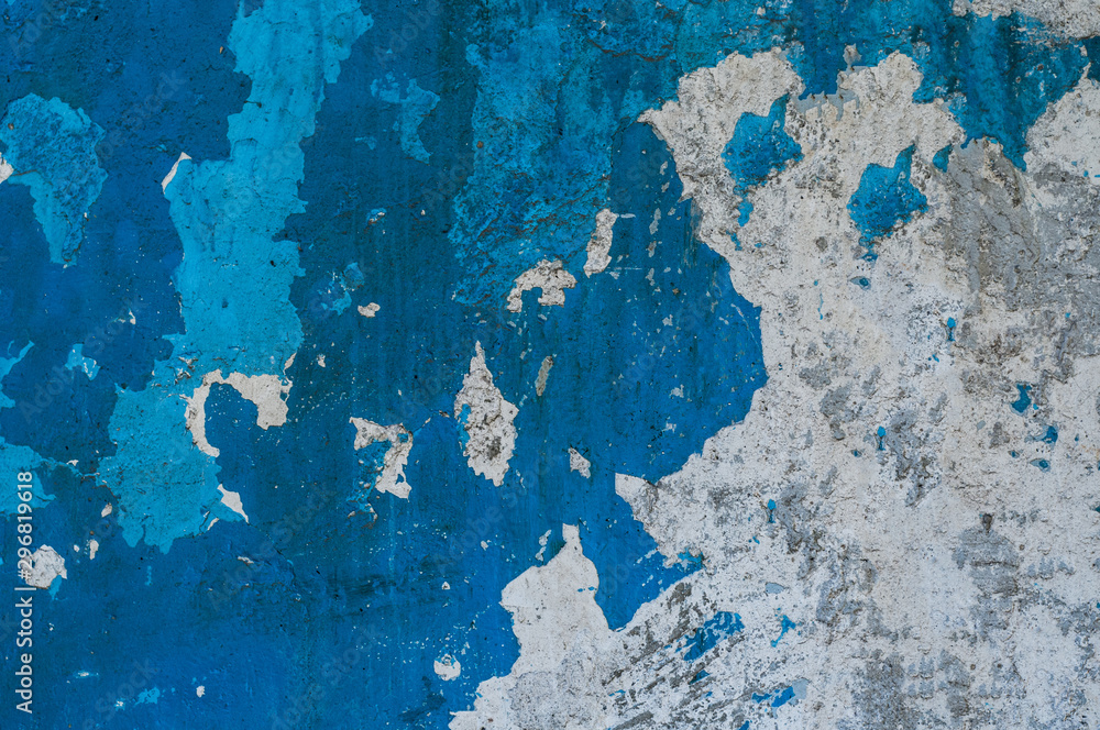 concrete wall texture, white-blue wall. peeling paint