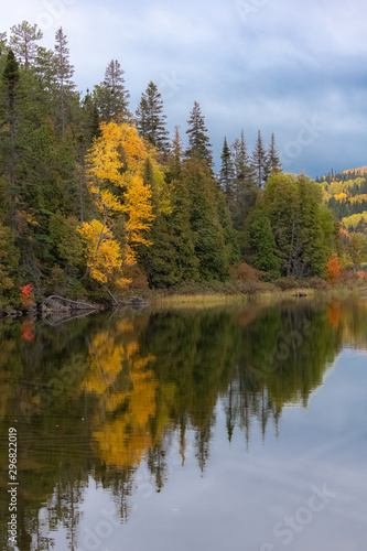  A lake in the forest in Canada, during the Indian summer, beautiful colors of the trees 