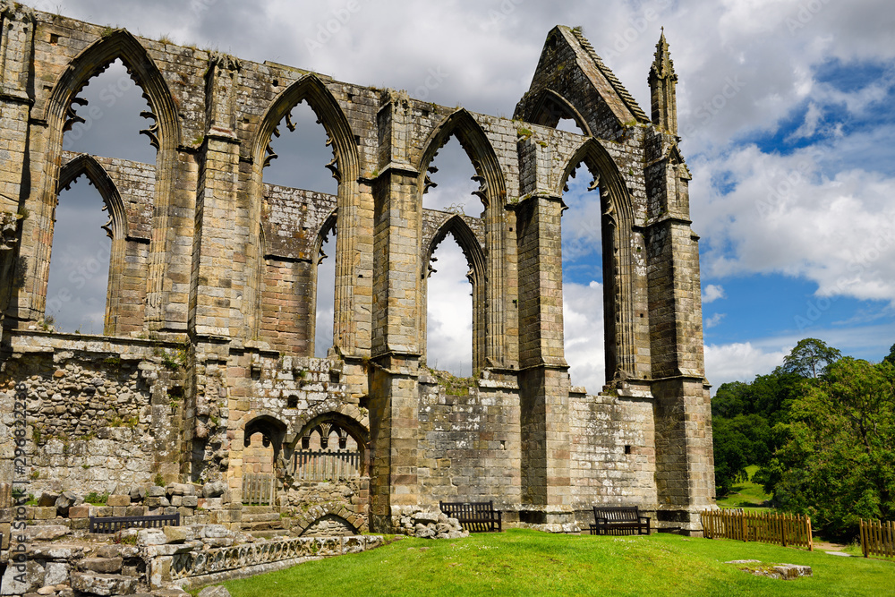 Stone window ruins of Bolton Priory church a 12th century Augustinian monastery at Bolton Abbey Wharfedale North Yorkshire England