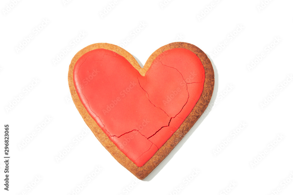 Decorated heart shaped cookie with cracks on white background, top view Decorated heart shaped cookie with cracks on white background, top view