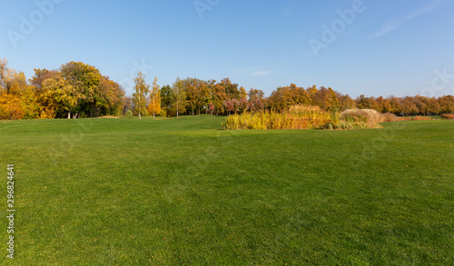 Autumn in the park and breathtaking view on the golf course.