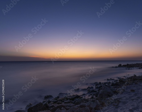 Gorgeous colorful view of sunset on Aruba. Beautiful nature landscape. Rocky coast of Atlanta  Caribbean.