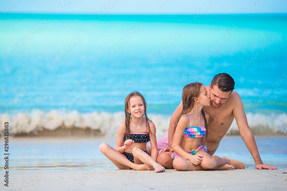 Father and kids enjoying beach summer vacation Father and kids enjoying beach summer vacation