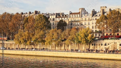 Sena river, trees, walk path and buildings in Paris