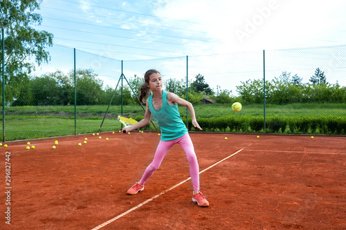 Young sports girl practicing tennis © didesign