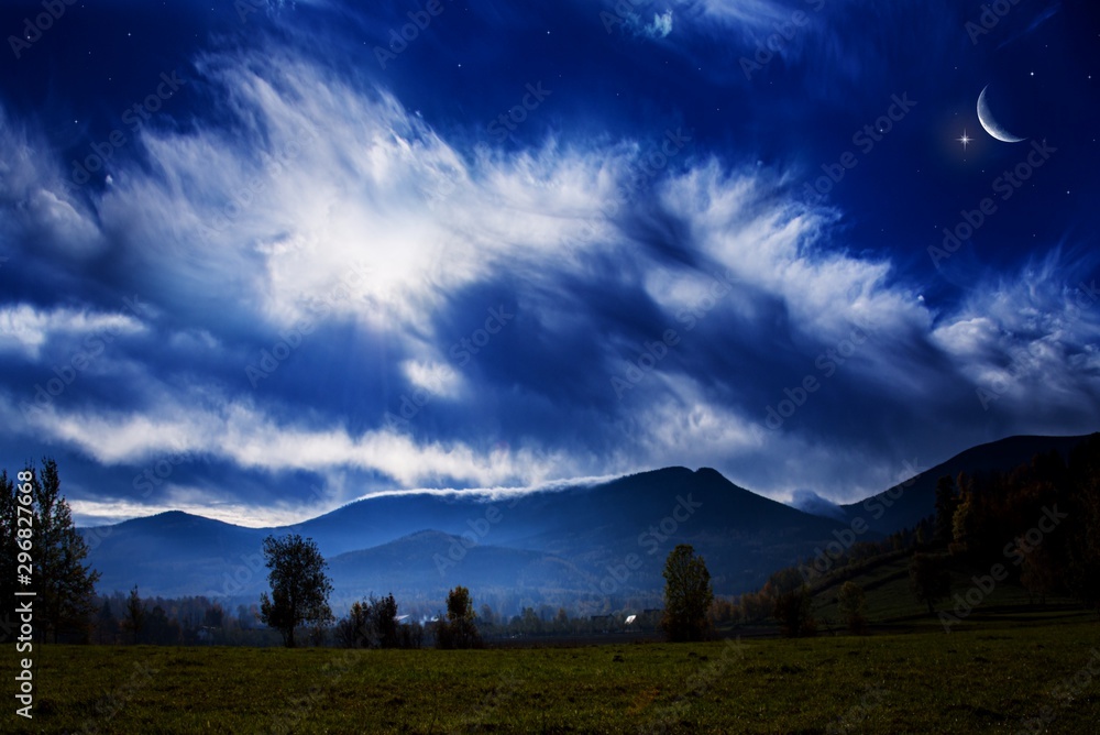 Obraz premium Moon and mountains . Beautiful night . A young month. Cloud landscape . Generous Ramadan . Light from sky . Religion background .