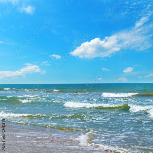 Beautiful sea and blue sky. Sand beach. The concept is travel.