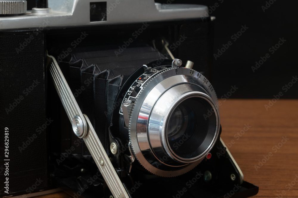 Classic Vintage Medium Format Folding Camera with A 120mm Film - obrazy, fototapety, plakaty 