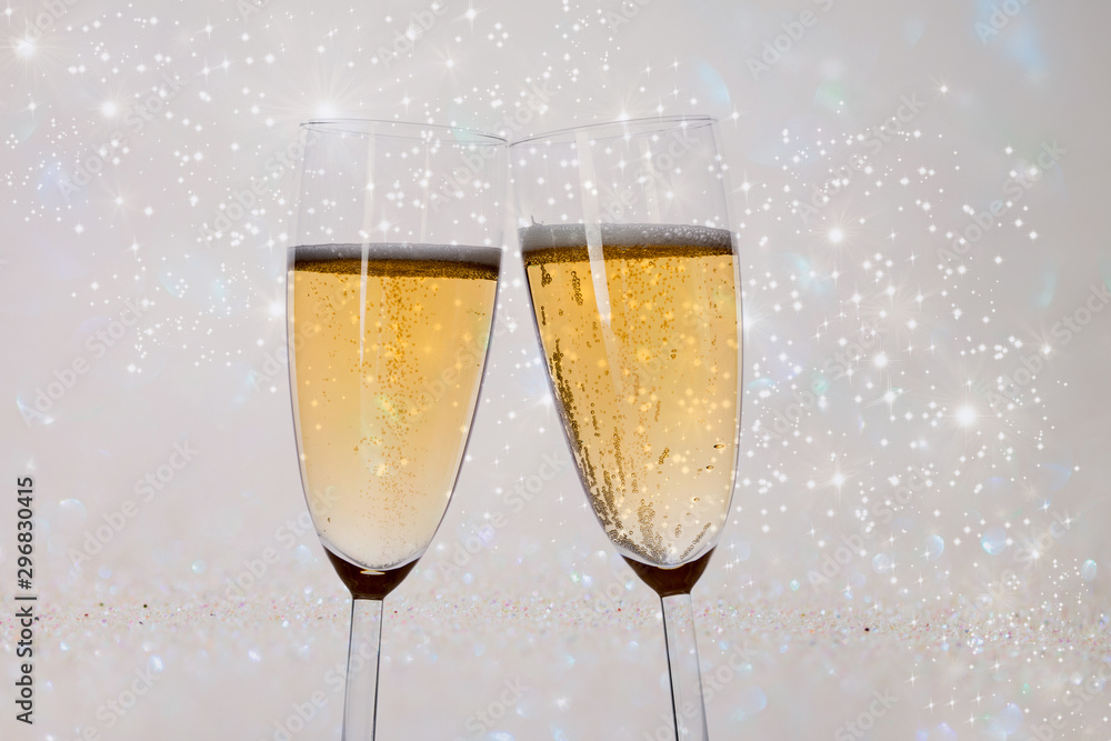 New Years eve concept with bokeh, fireworks and glasses of champagne. New Years eve concept with bokeh, fireworks and glasses of champagne.