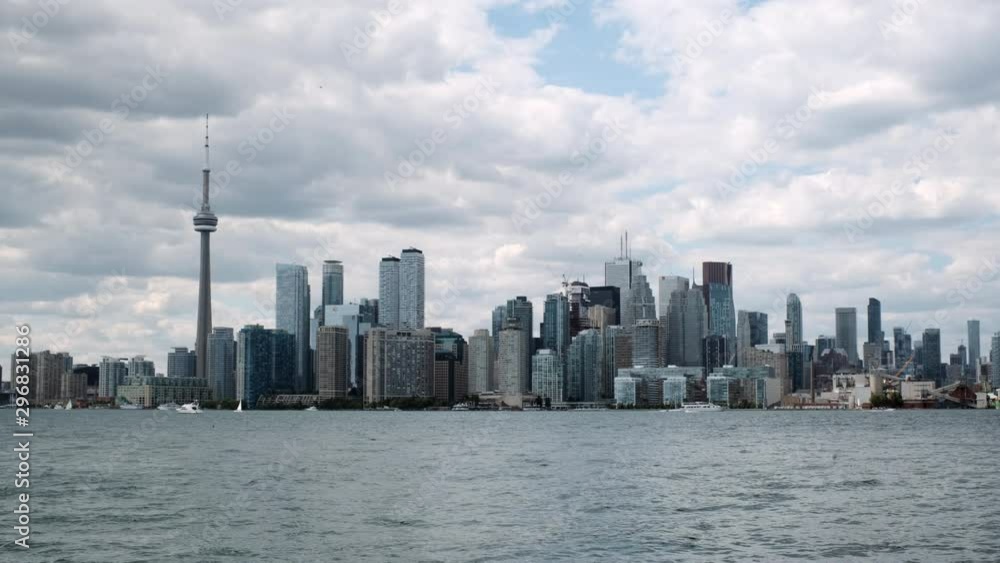 Toronto Skyline with Lake Ontario in Foreground, Clouds Above Toronto Skyline with Lake Ontario in Foreground, Clouds Above