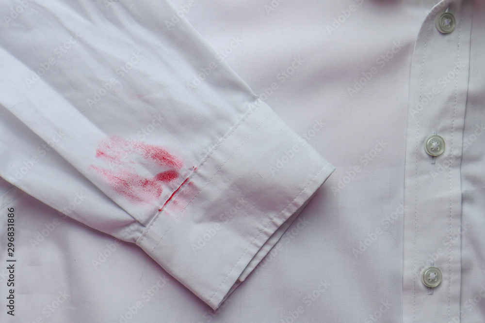 Dirty lipstick stain on white shirt. Stain remover concept Dirty lipstick stain on white shirt. Stain remover concept