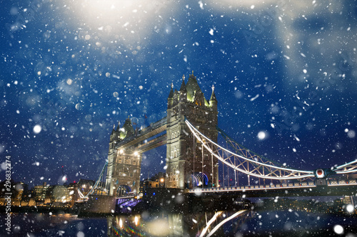 Photography Tower bridge of London in snow at dawn.