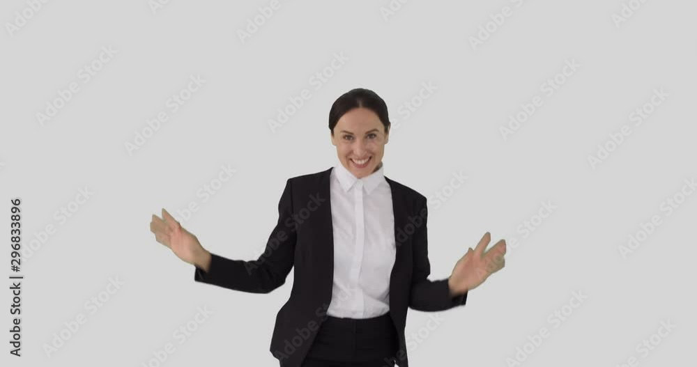 Businesswoman having fun dancing over white background Businesswoman having fun dancing over white background