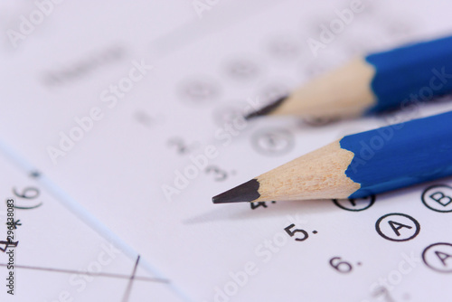Pencil on answer sheets or Standardized test form with answers bubbled. multiple choice answer sheet