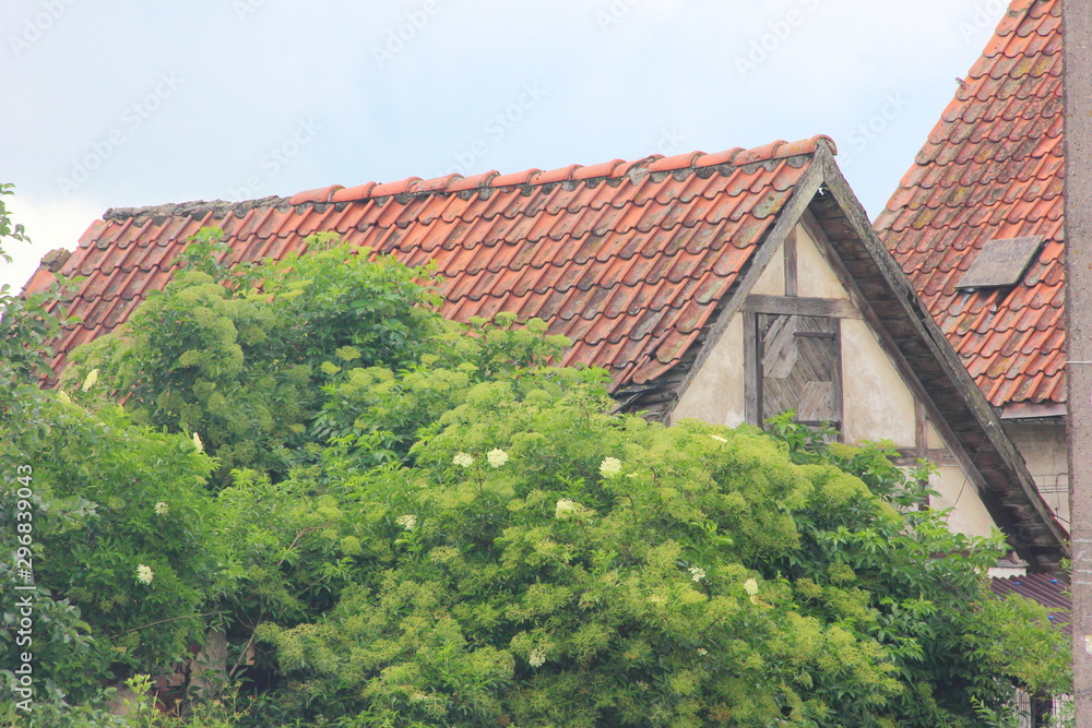 An old German building with a tiled orange roof
