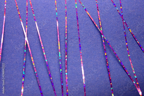 This is a photograph of a abstract geometric design created using colourful tape applied onto a Blue paper