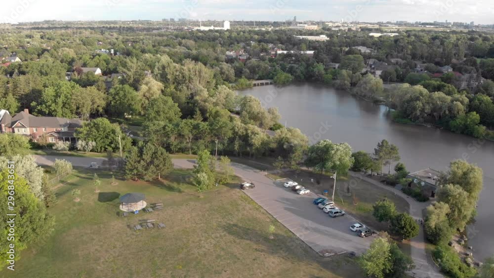 Aerial Drone Shot Flying Over Pond and Forest in Quaint Town Aerial Drone Shot Flying Over Pond and Forest in Quaint Town