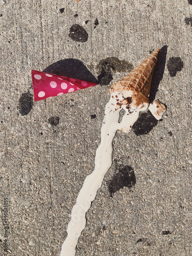 Ice cream melting on sidewalk