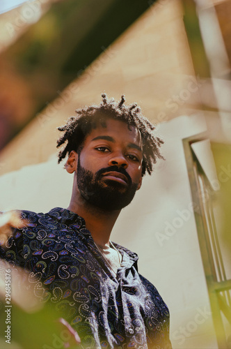 Low angle view of man with beard looking down
