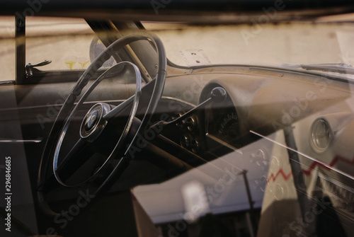 View of steering wheel through car window