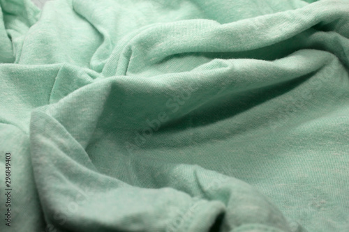 This is a photograph of textured light Green fabric