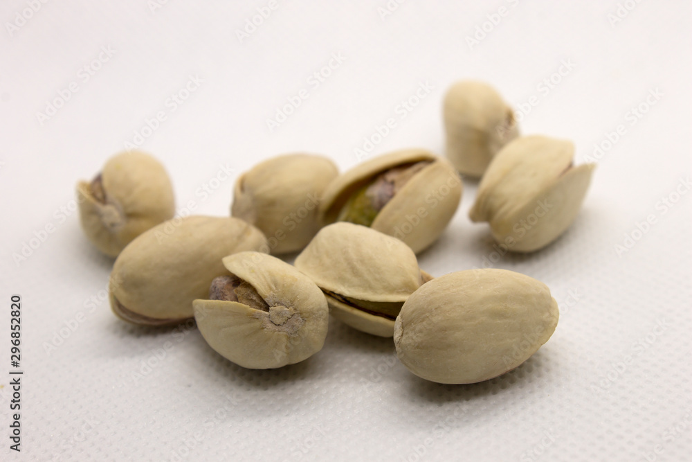This is a photograph of Pistachios isolated on a White background